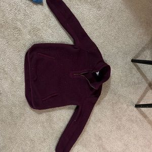 Burgundy/wine Sherpa sweater. Large front pocket and zipper.